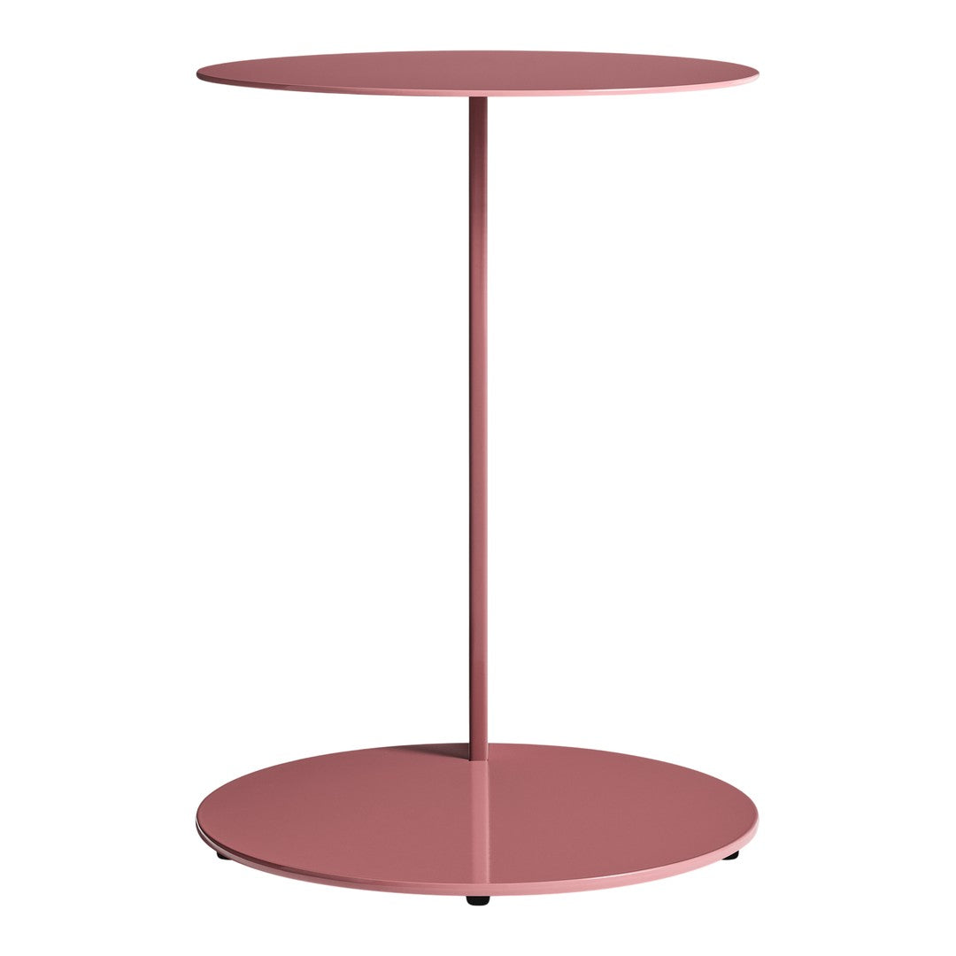 Pink circular side table with a sleek, minimalist design and smooth matte finish. Ideal for modern decor.