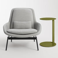 Gray upholstered armchair with black legs and a matching green accent side table. Modern and minimalist design.