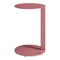 Minimalist pink side table with a round top and base, featuring a sleek, modern design.