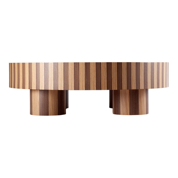 Round coffee table with a striped wood pattern in warm brown tones, featuring bold contrasting stripes and rounded pedestal legs.