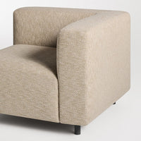 Beige textured couch corner with a soft, subtle pattern, showcasing modern, minimalist design.