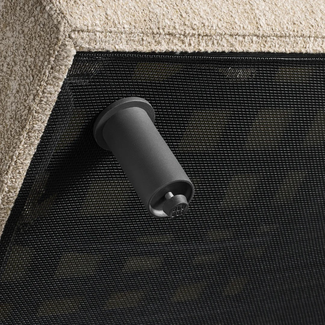 Black mesh pattern with beige textured fabric detail, featuring a sleek black fitting. Ideal for modern outdoor decor.