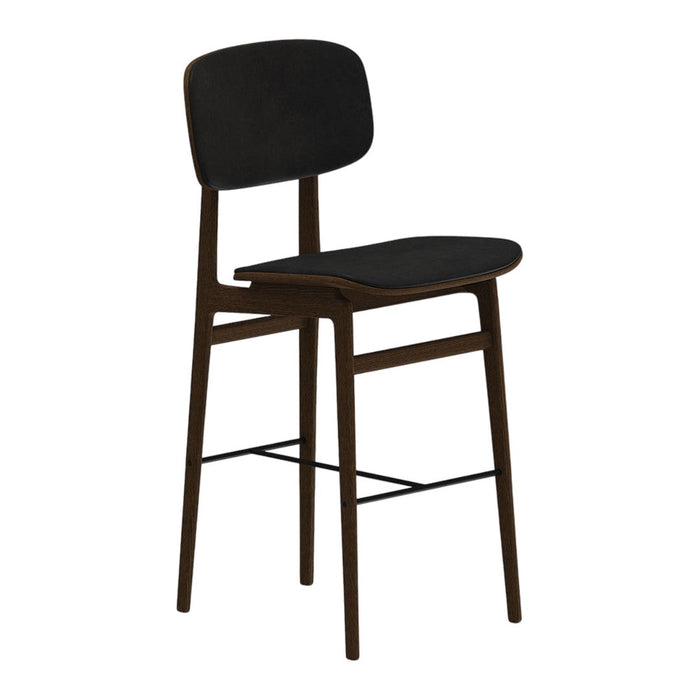 Black upholstered bar stool with a minimalist design and dark wood legs, perfect for modern decor.