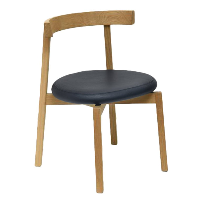 "Modern wooden chair with natural oak finish and sleek black cushion for a minimalist touch."