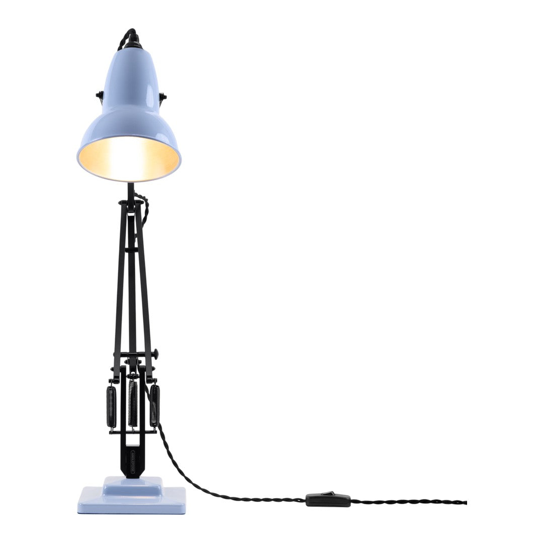 Blue metal lamp with black accents and a patterned cord, featuring a minimalist design and sleek silhouette.