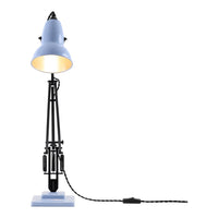 Blue metal lamp with black accents and a patterned cord, featuring a minimalist design and sleek silhouette.