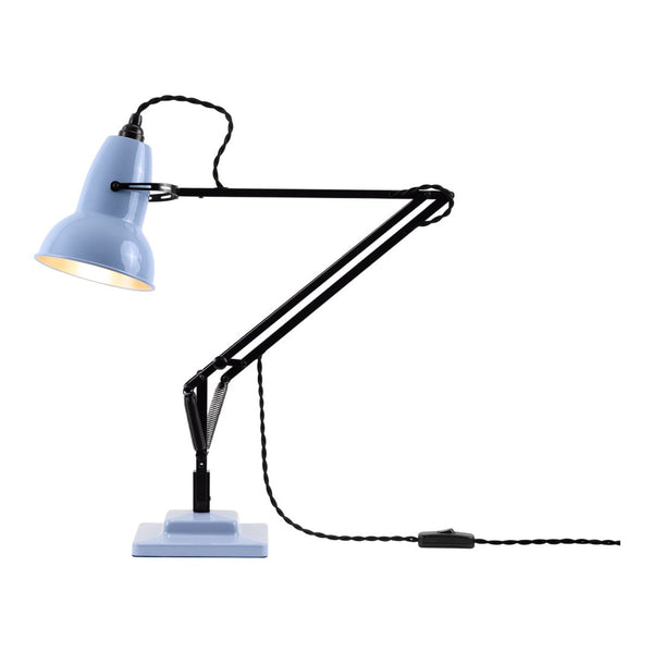 Blue desk lamp with a black adjustable arm and patterned cord, featuring a smooth base for stylish illumination.