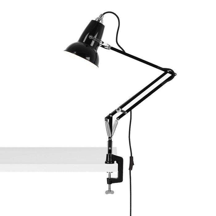 Black adjustable desk lamp with sleek metallic accents and a minimalist design, perfect for modern workspaces.