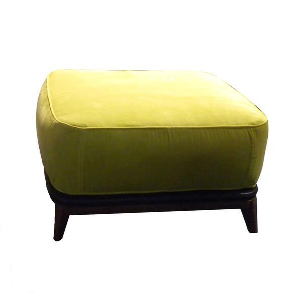 Bright yellow velvet ottoman with a smooth finish and dark wooden legs, adding a pop of color to any space.
