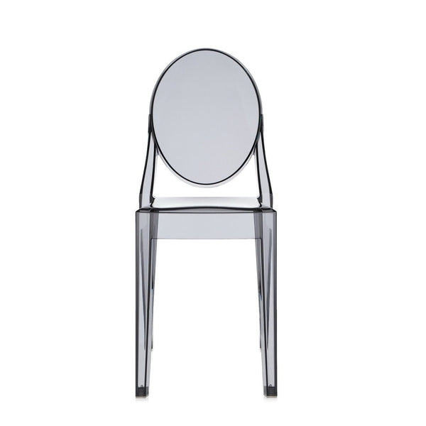 Transparent grey acrylic chair with an oval back and sleek, modern design. Ideal for contemporary decor.
