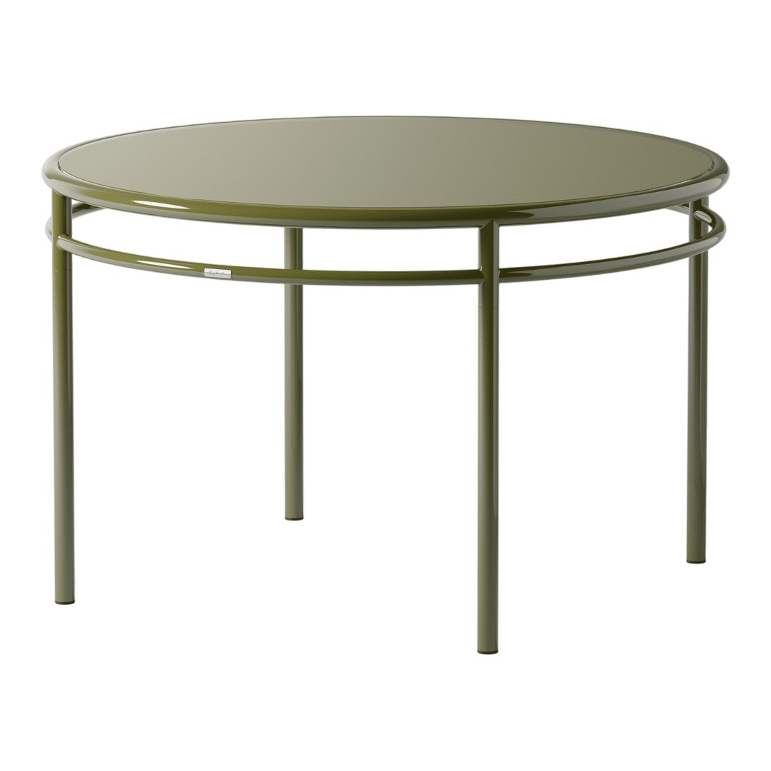 Round green metal table with a smooth surface and sleek, minimalistic design. Ideal for modern decor.