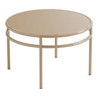 Round beige metal coffee table with a smooth, glossy finish and minimalistic design. Perfect for modern decor.