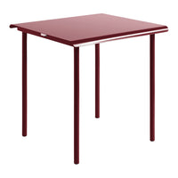 Red tabletop with sleek, smooth surface and contrasting white trim, supported by simple metal legs.