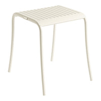 White slatted metal stool with a minimalist design, perfect for modern and outdoor settings.
