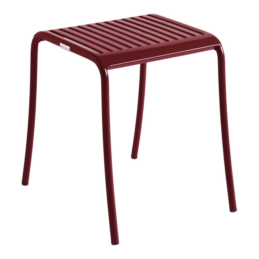 Red striped stool with a sleek, modern design and smooth metal legs. Perfect for outdoor or indoor settings.