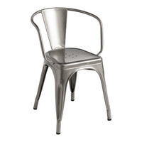 Silver metal dining chair with a sleek, modern design and perforated seat pattern. Ideal for contemporary spaces.