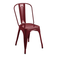 Red metal chair with a sleek, minimalist design and perforated seat, perfect for modern decor.
