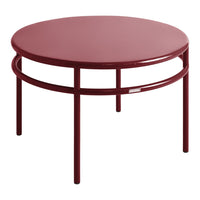Round burgundy coffee table with a sleek metal frame and smooth surface, ideal for modern decor.