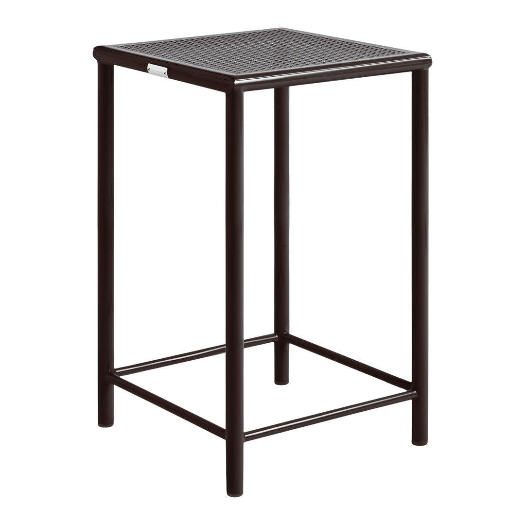 Black metal bar table with a textured pattern on the top surface and sleek, minimalistic design.