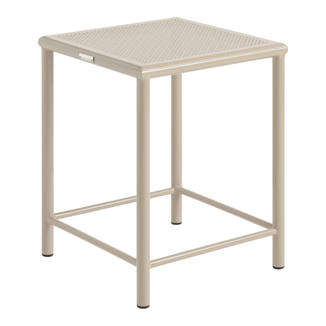 Beige metal side table with a textured, perforated top and sleek design, perfect for indoor and outdoor use.
