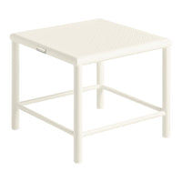White square side table with a textured surface, complemented by a simple, understated design.