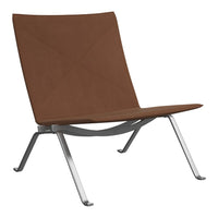 Modern brown lounge chair with a minimalist design and sleek silver frame, showcasing a soft, textured upholstery.