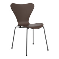 Brown butterfly chair with smooth molded seat and sleek chrome legs, perfect for modern décor.
