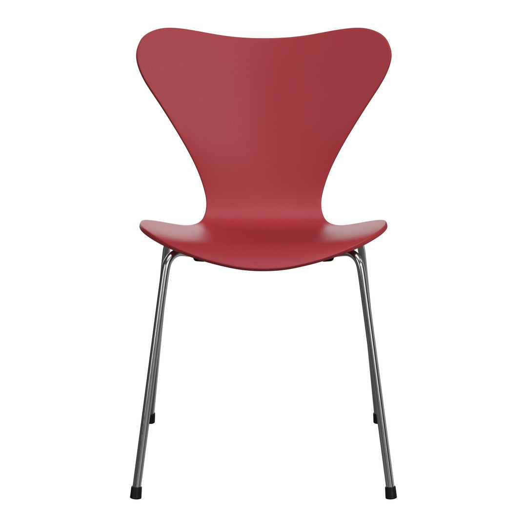 Red contemporary chair with a smooth, curved silhouette and metallic gray legs, perfect for modern decor.