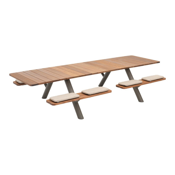 Wooden picnic table with a natural brown finish and beige seat cushions, featuring clean, modern lines.