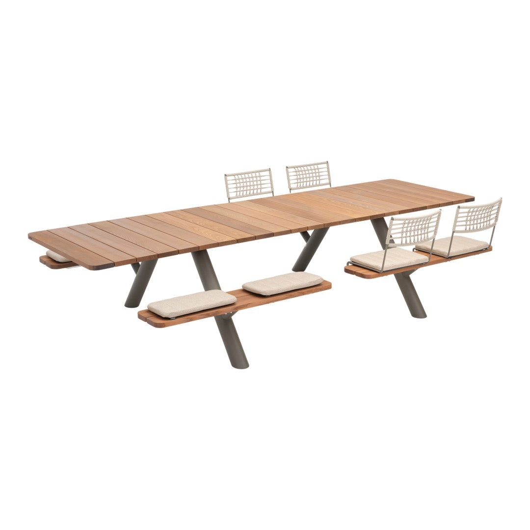 Rectangular wooden dining table with brown slats, gray metal legs, and light beige cushioned seats in a modern design.