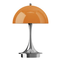 Modern lamp with a glossy orange dome shade and sleek metallic base, perfect for contemporary decor.