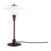 Burgundy table lamp with a smooth white glass shade and a sleek black cord. Elegant and modern design.