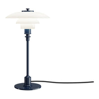 Navy blue lamp with layered white shades and a sleek black cord. Elegant design for modern decor.
