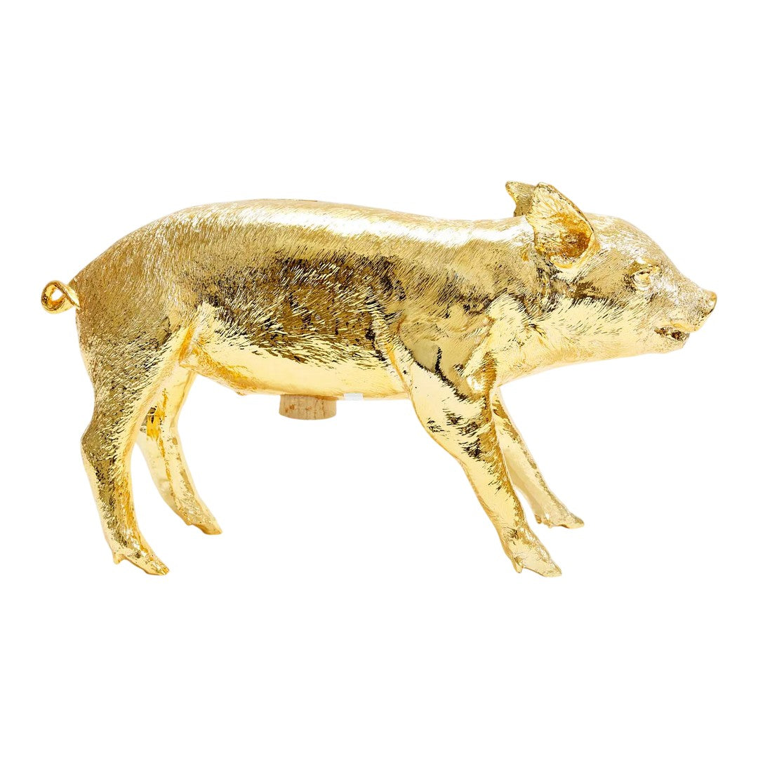 Gold pig figurine on a white background