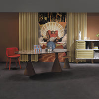 Modern dining room featuring a marbled table, vibrant red chair, golden curtains, and earthy brown tones.