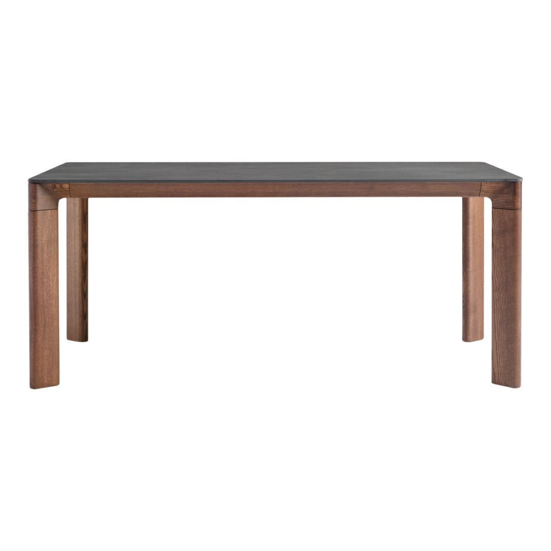 Stylish wooden dining table with a dark surface and warm brown legs, showcasing a sleek, modern design.