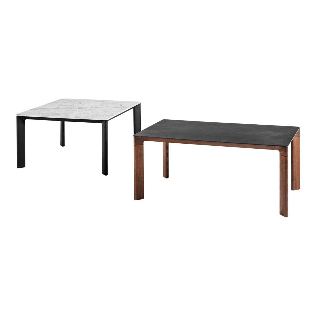 Two square tables: one with a gray patterned top and black legs, the other with a solid black top and wood-toned legs.
