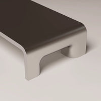 Minimalist gray and beige bench with smooth, sleek edges and a modern design. Ideal for contemporary spaces.