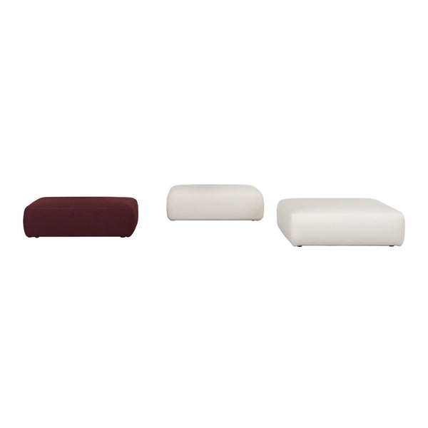 Set of three poufs in deep burgundy and soft white, featuring smooth, contemporary designs with rounded edges.