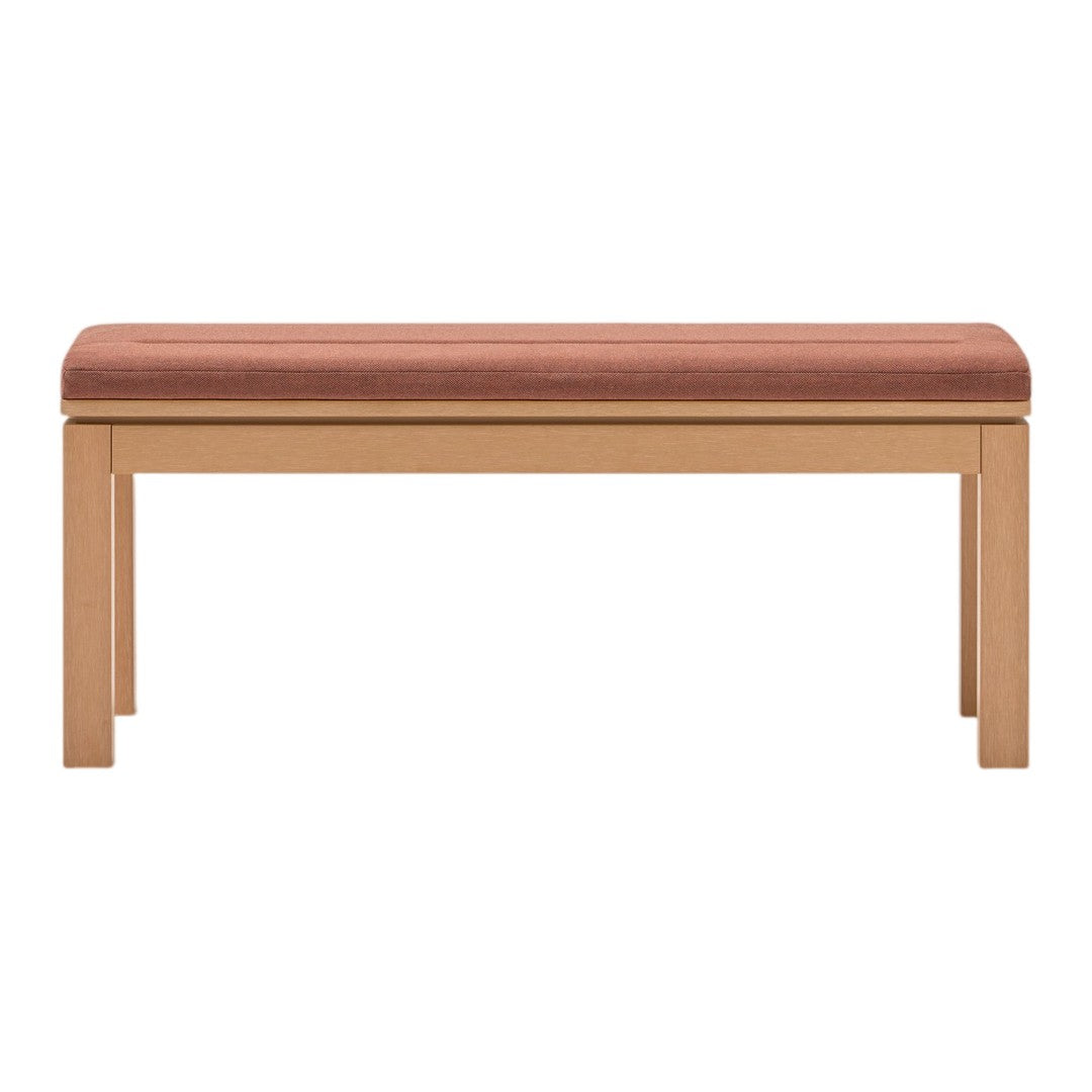 Beige wooden bench with a soft brown upholstered top, featuring a sleek, minimalist design.