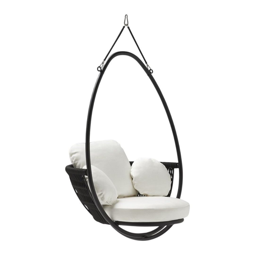 Black hanging egg chair with plush white cushions, featuring smooth curves and modern design. Perfect for stylish interiors.