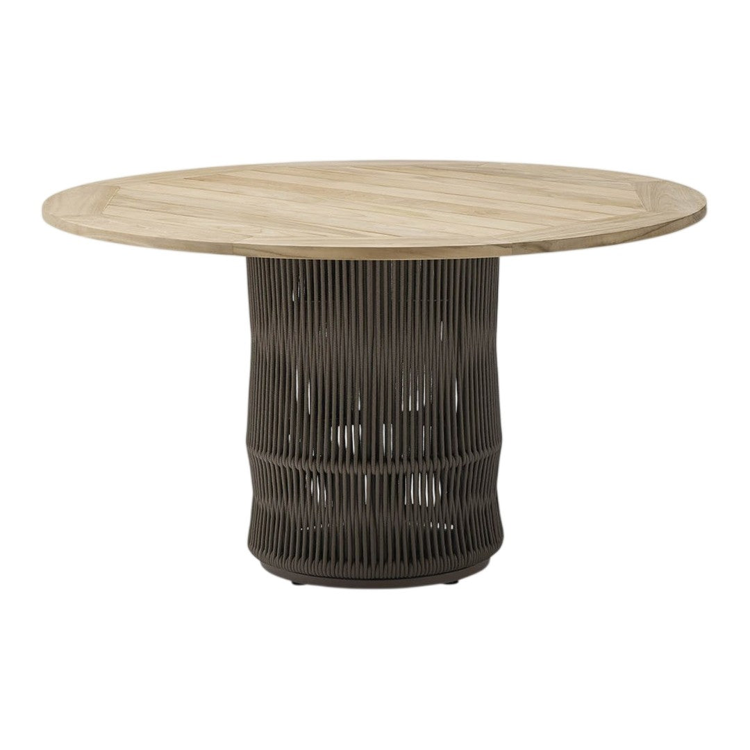 Round dining table with a light wooden top and dark, ribbed base. Modern design with natural and neutral tones.