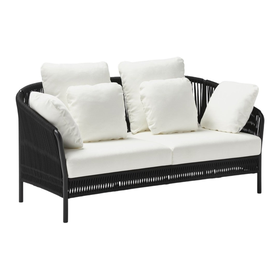 Black wicker sofa with white cushions, featuring a sleek, modern design perfect for indoor or outdoor spaces.