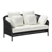 Black wicker sofa with white cushions, featuring a sleek, modern design perfect for indoor or outdoor spaces.