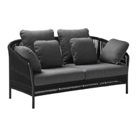 Black wicker sofa with gray cushions, featuring a sleek, modern design and cozy, plush pillows. Perfect for outdoor spaces.