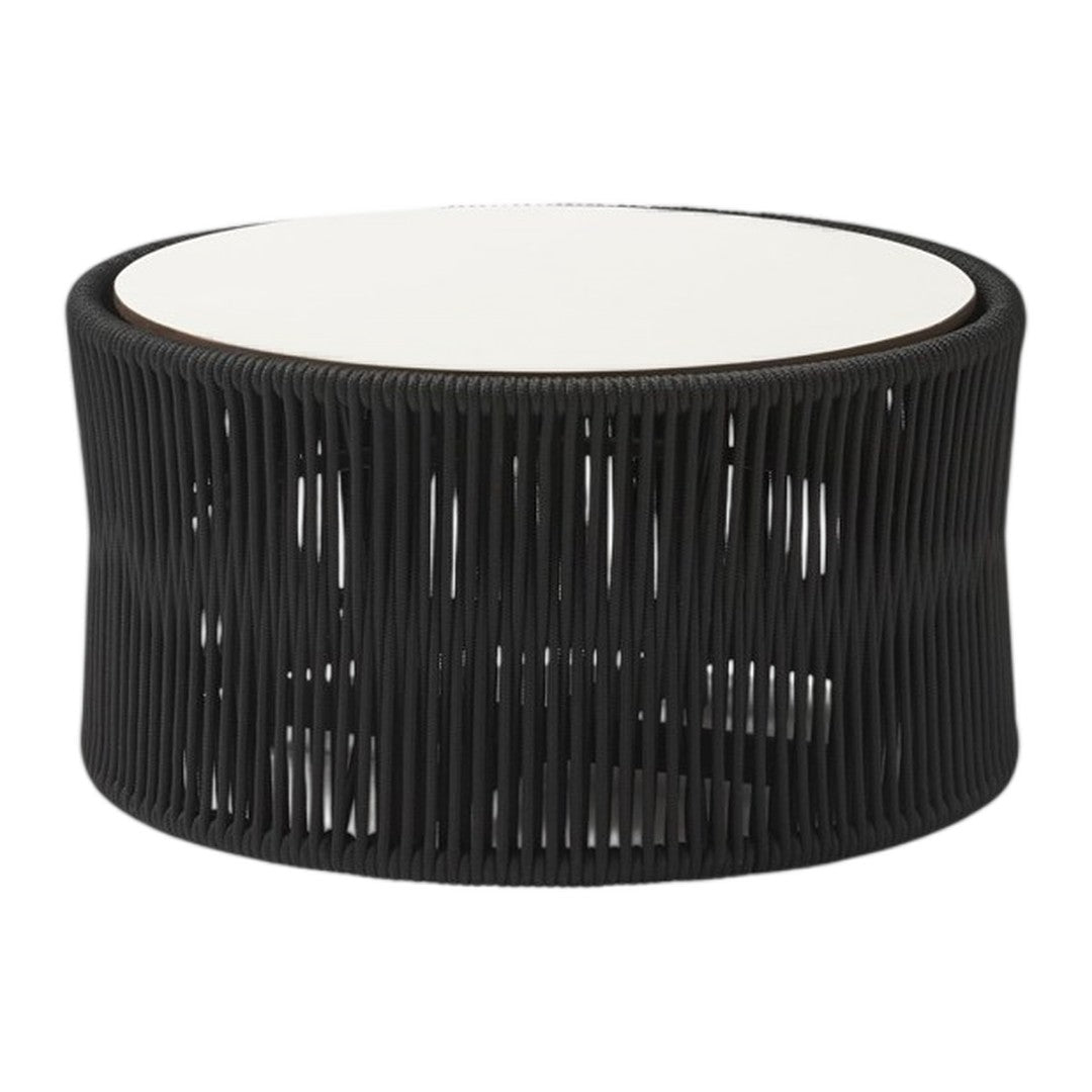 Black woven rattan table with a sleek white top and an open, airy design. Perfect for modern decor.