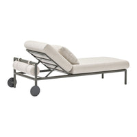 Light beige lounge chair with a sleek, minimalist design and subtle textured fabric. Features gray metal frame.