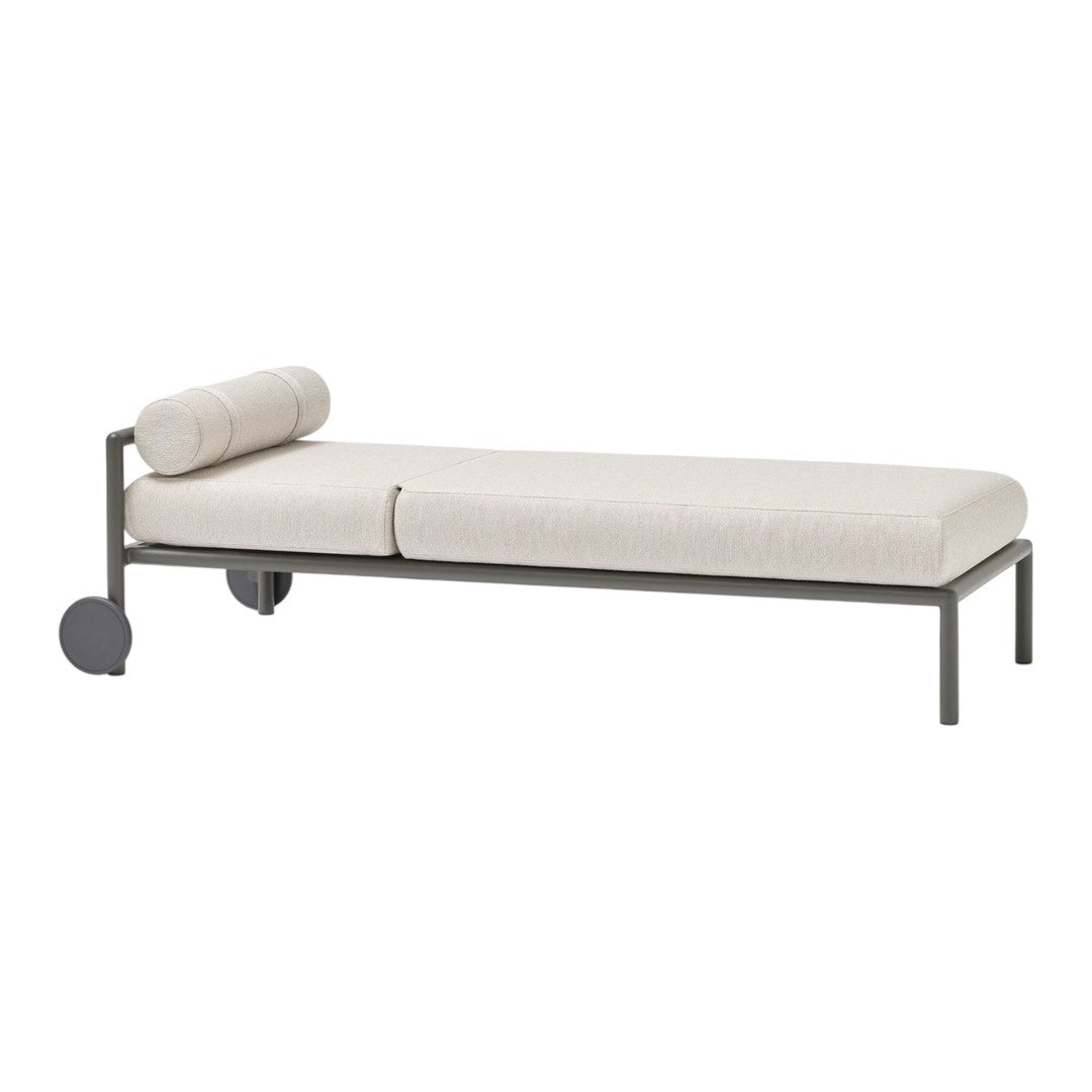 Light beige fabric daybed with a minimalist steel frame and cylindrical pillow, perfect for modern decor.