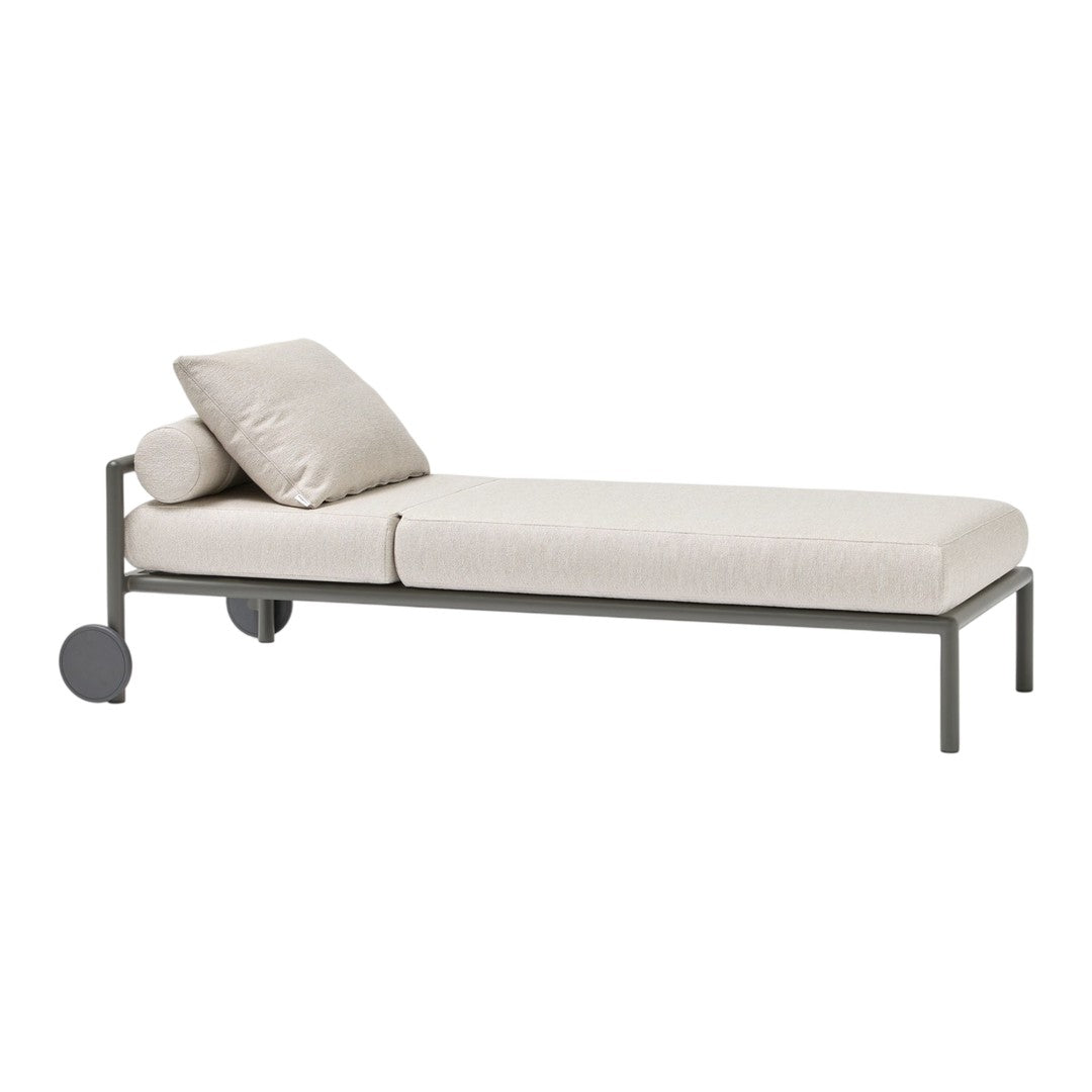 Light beige chaise lounge with a subtle textured pattern, featuring a sleek gray metal frame and a matching cushion.