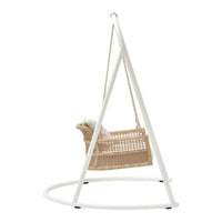 White metal frame with natural rattan swing chair, featuring a neutral cushion for added comfort.